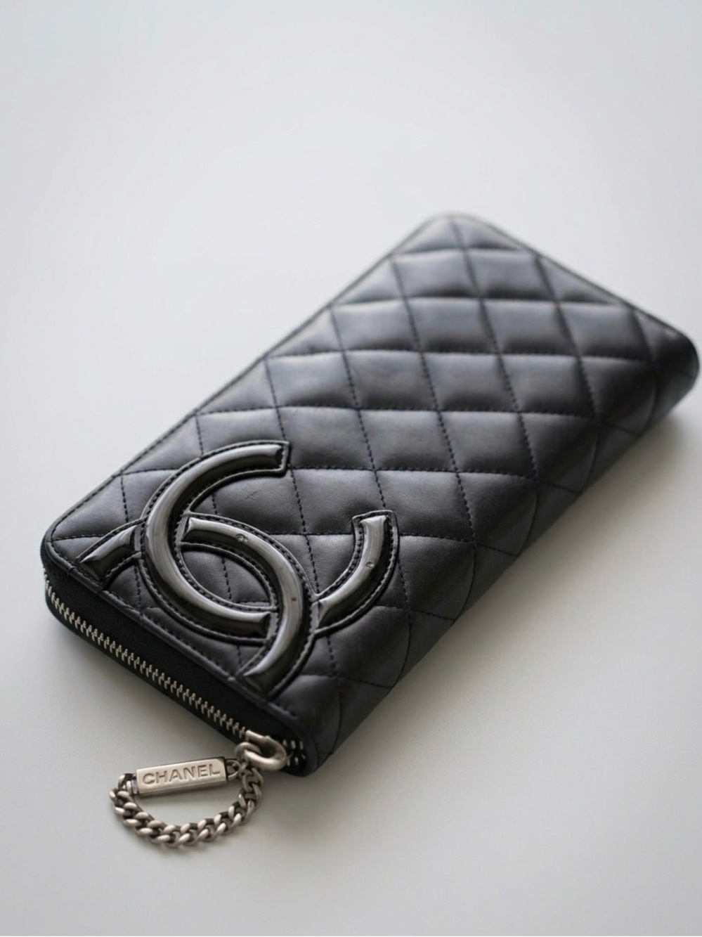 CHANEL Black Quilted Leather Zip-Around Wallet with Chain Pull